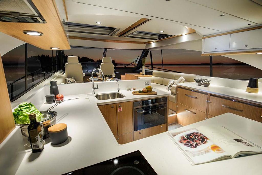 From aft galley to helm, the luxurious interior of the 525 SUV is bathed in natural light © Riviera Australia